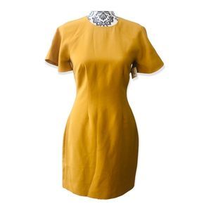 Keepsake dress the colour is a mustard with short sleeve size small